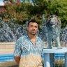 Irv Antonio in front of the lion fountain.